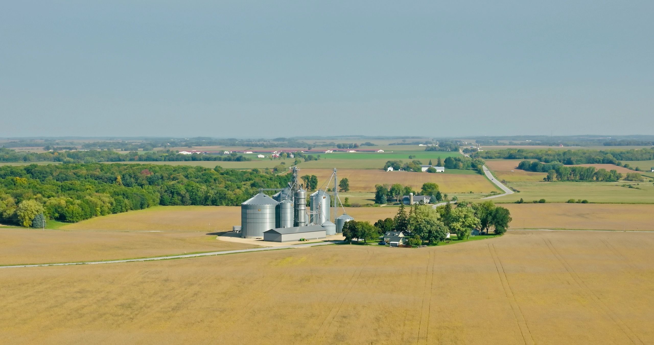 Grain silos and farmland representing storage and supply chain resilience