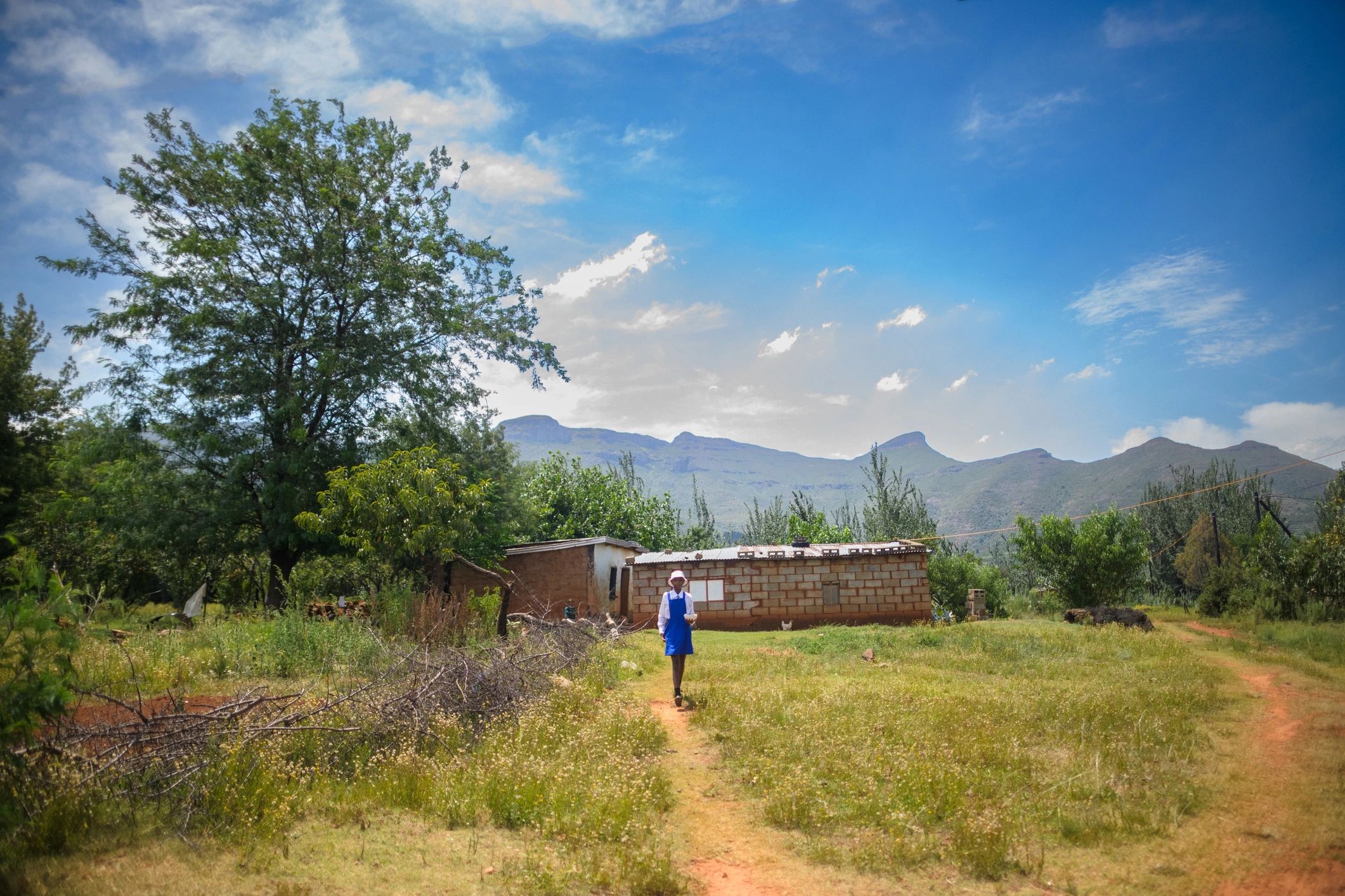Student walking to school, representing community investment