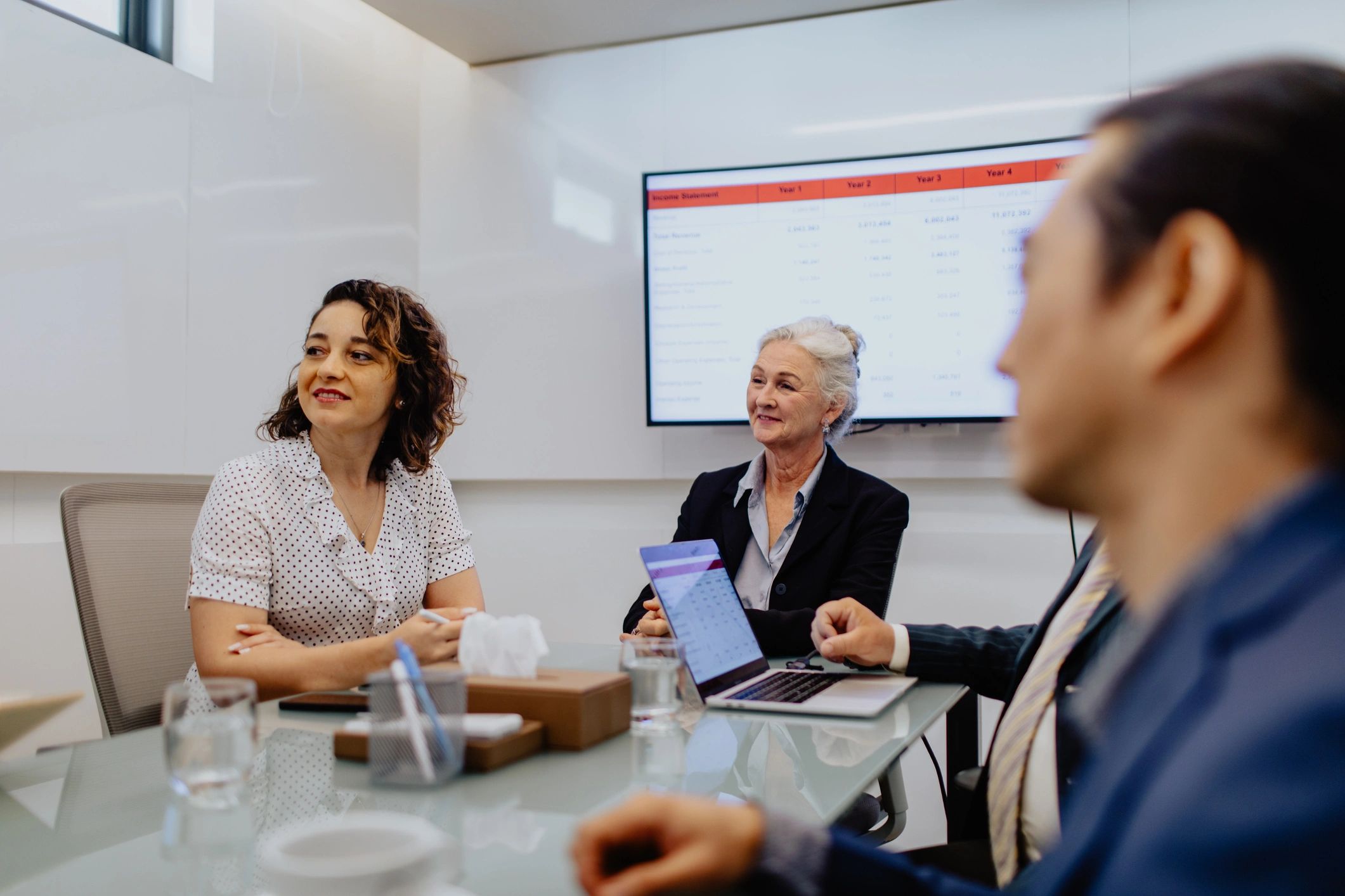 Executive team meeting representing stakeholder alignment and financing discussions