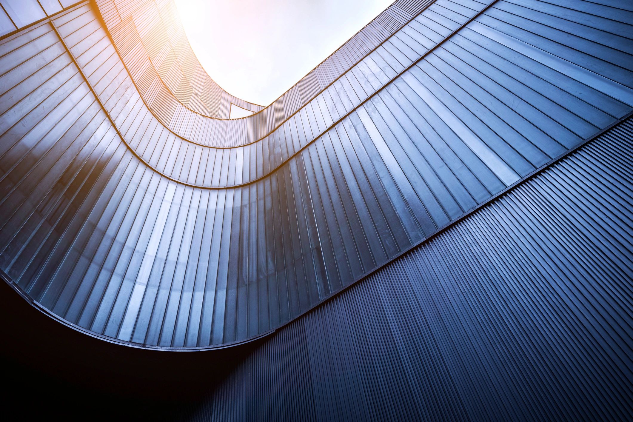 Modern glass building facade representing corporate presence and global operations